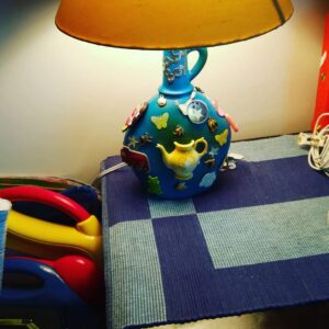 Old bottle and toys recycled to make a lamp